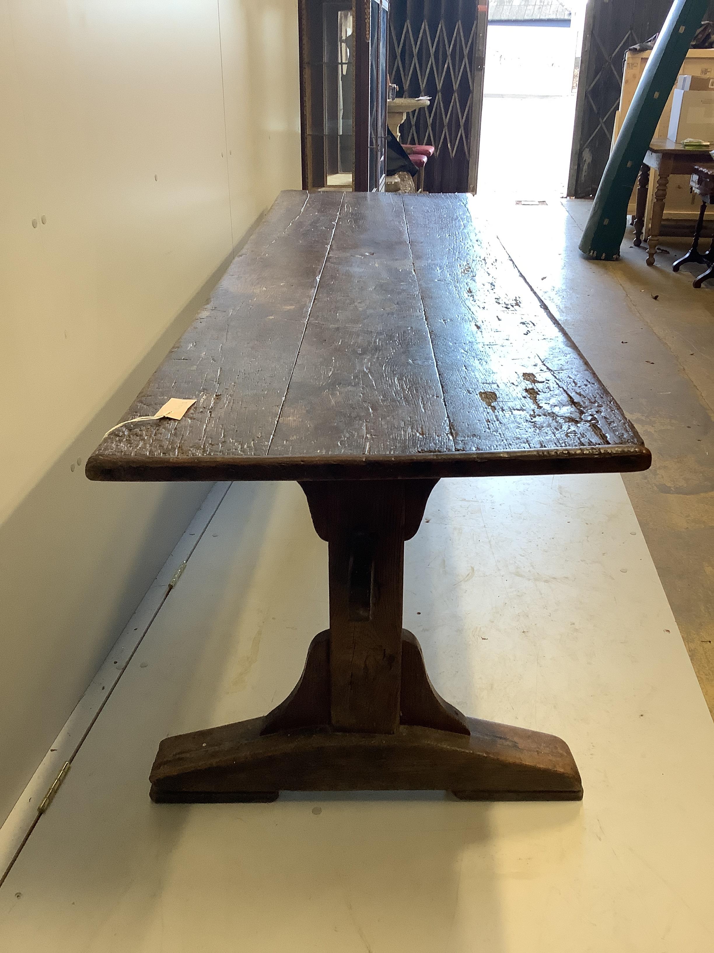 An 18th century and later rectangular oak plank top refectory table, length 226cm, depth 66cm, height 72cm